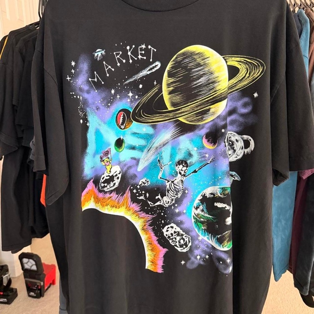Grateful Dead Market T with graphic of skeletons in space with planets and stars